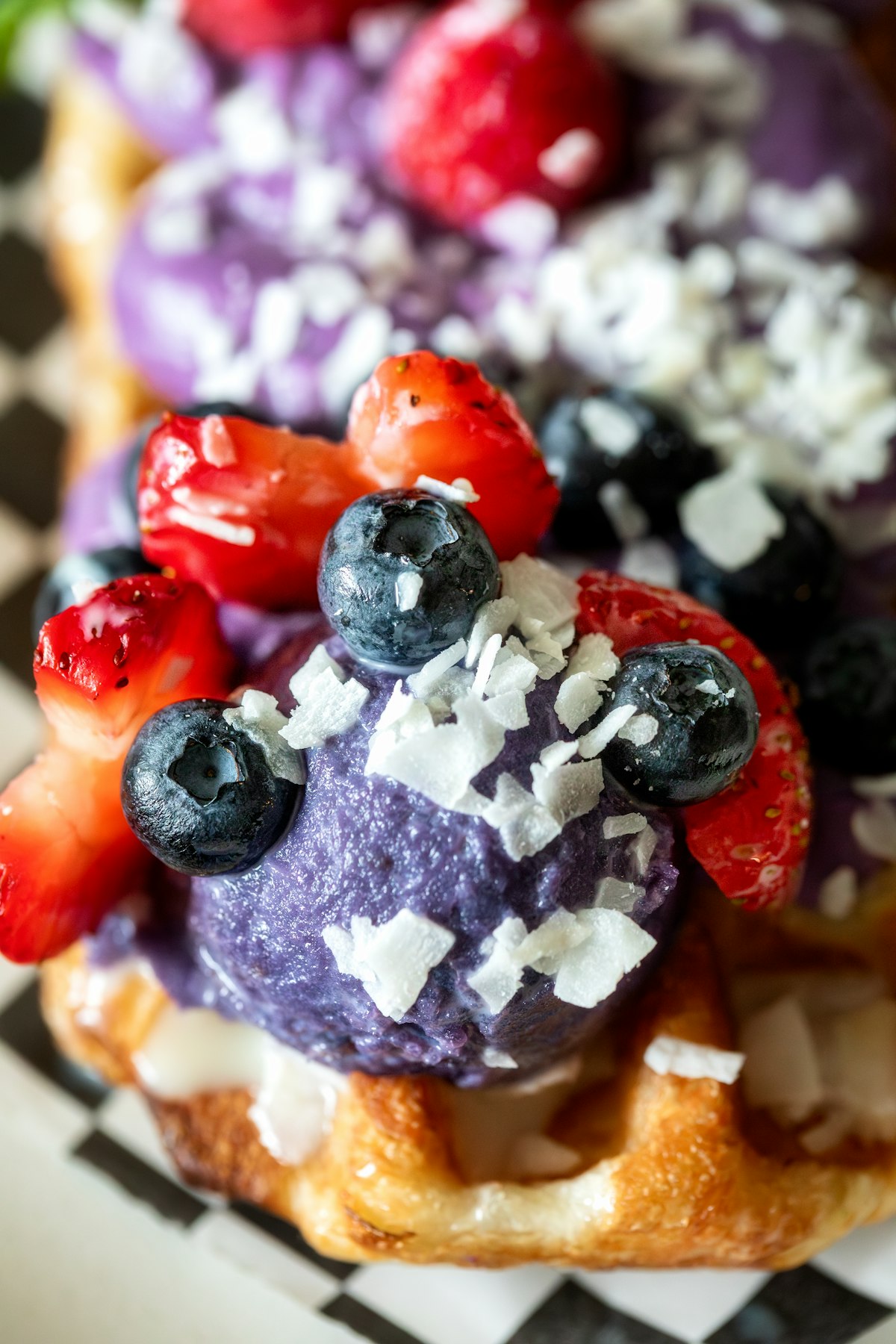 Waffles with ube cream and berries